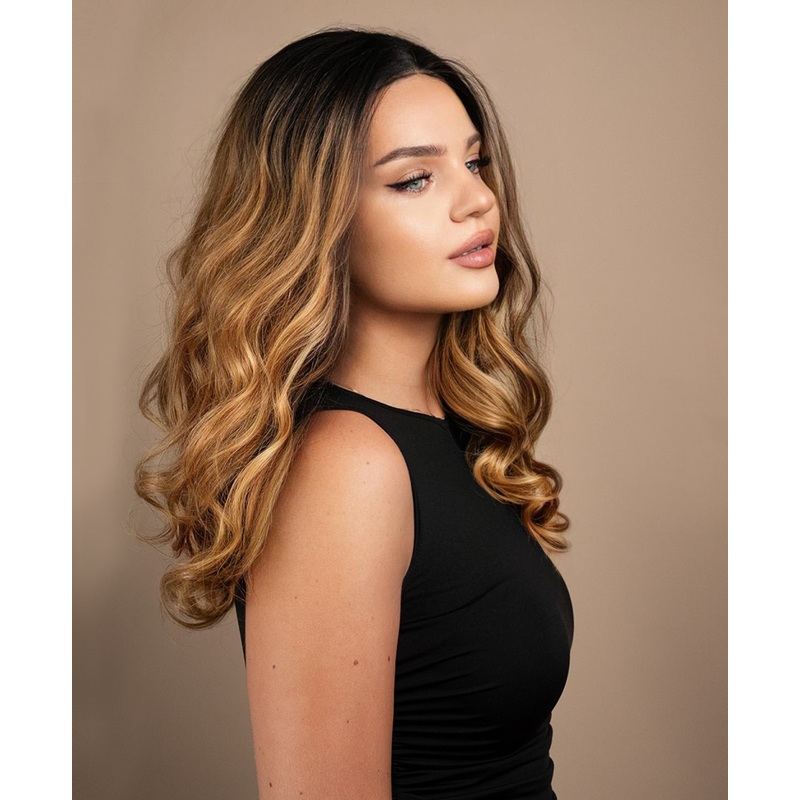 lace front human wig – 18″ rooted caramel bouncy curls.